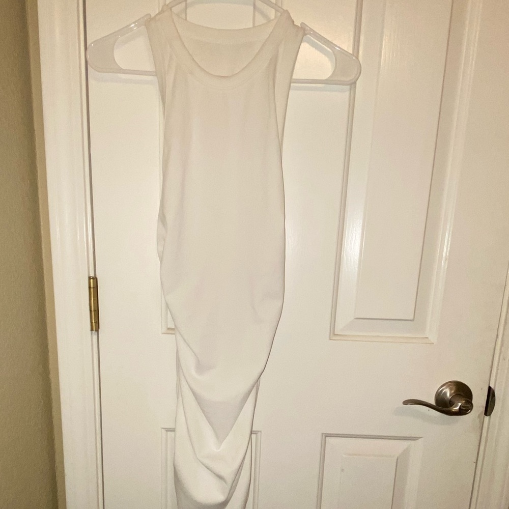 Medium length white scrunched side dress